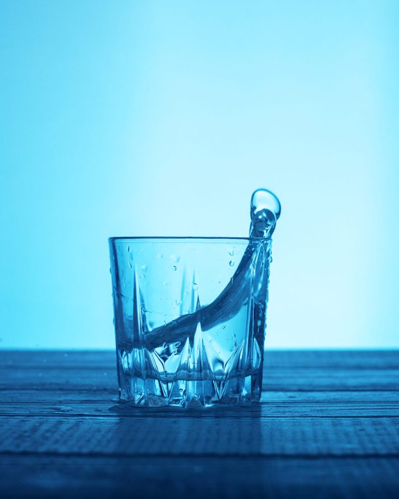 Clean water in a glass. The concept of beverages and health.
